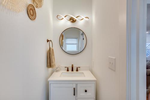 a bathroom with a sink and a mirror at The Kraken Wildwood Townhome half Mi to Beach! in Wildwood
