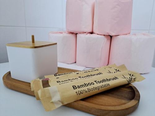 a bunch of pink candles on a cutting board at CENTER o'CLOCK in Xanthi