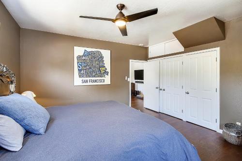 a bedroom with a bed and a ceiling fan at Bed and Biscuit in Guerneville