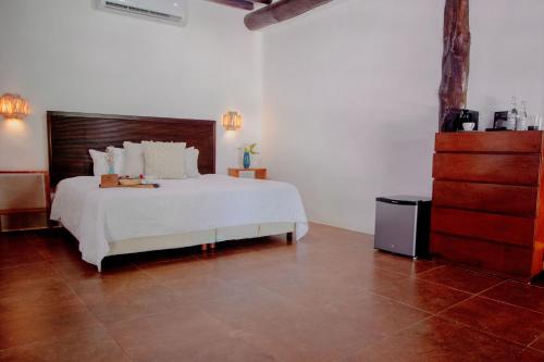 Ein Bett oder Betten in einem Zimmer der Unterkunft Las Nubes de Holbox