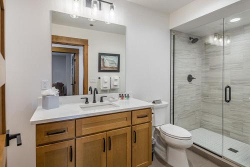 a bathroom with a sink and a toilet and a shower at Suncadia 4 Bdrm Home with Hot Tub Overlooking Golf Course in Cle Elum