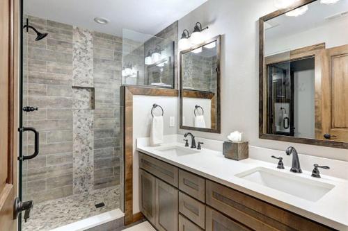 a bathroom with two sinks and a shower at Great Location Near Pool with Suncadia Pool Access in Cle Elum