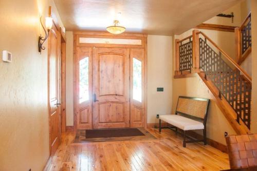 a hallway with a wooden door and a stair case at Suncadia 5 Bdrm Home that Sleeps 16 in Cle Elum