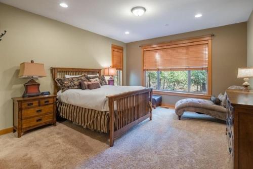 a bedroom with a large bed and a window at Suncadia 5 Bdrm Home with Hot Tub in Cle Elum