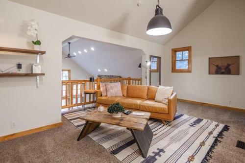 a living room with a couch and a table at Suncadia 5 Bed Refined Alpine Home in Cle Elum