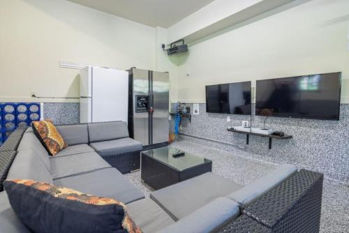 a living room with a couch and a tv at Suncadia 5 Bed Refined Alpine Home in Cle Elum