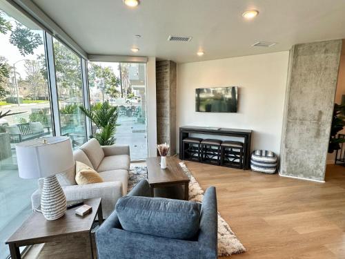 a living room filled with furniture and a fireplace at Nimitz Crossing Luxury Residences in San Diego