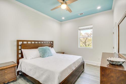 a bedroom with a bed and a ceiling fan at Long Beach Home with Views and On-Site Beach Access! in Long Beach