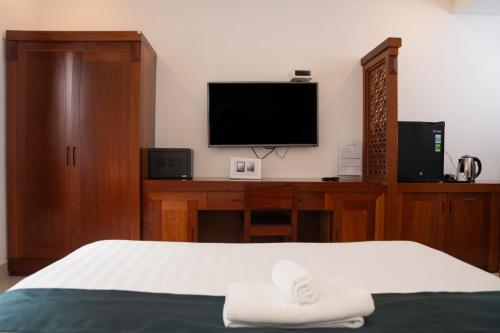 Ένα ή περισσότερα κρεβάτια σε δωμάτιο στο Twins Hotel
