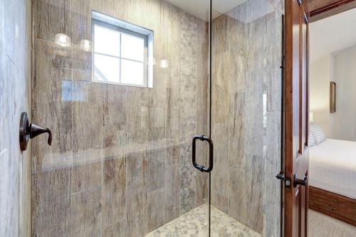 a bathroom with a shower with a glass door at Great Location Near Pool with Suncadia Pool Access in Cle Elum