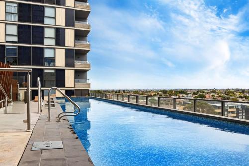 a swimming pool on the roof of a building at Pride Moonee Ponds 1B2B Nest in Melbourne