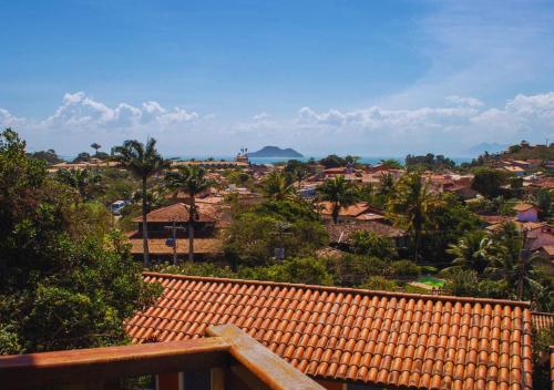 a view of a city from a roof of a house at Calador Búzios Hotel in Búzios