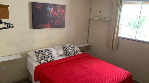Un pat sau paturi într-o cameră la Casa Dourada - Abraão - IG