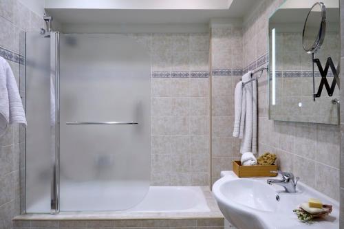 a bathroom with a shower and a sink at Acropolis 2BD Private Entrance Apt in Athens