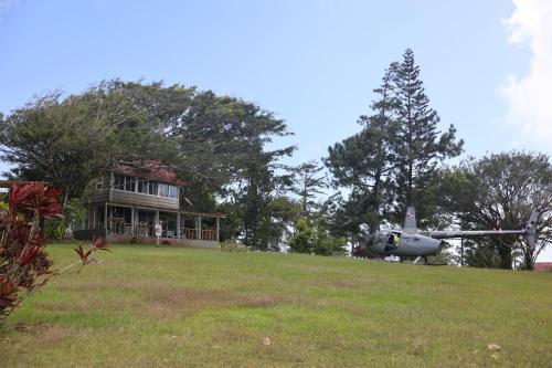 a helicopter parked in front of a house at La Dama de los vientos in Cerro Azul