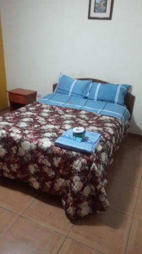 A bed or beds in a room at Cuarto Duplex