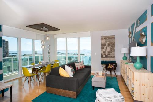 a living room with a couch and a table at Coconut Grove Gorgeous Bay View 1 bedroom Condo Includes Parking in Miami