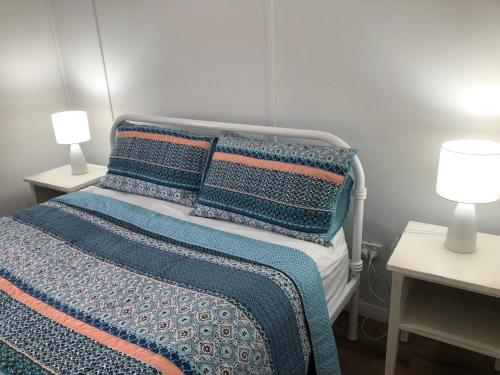 Katil atau katil-katil dalam bilik di Sandhills Cottage