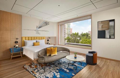 Postel nebo postele na pokoji v ubytování Hyatt Centric Ballygunge Kolkata