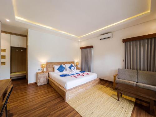 Säng eller sängar i ett rum på Ubud Shanti Rice Field House By Supala