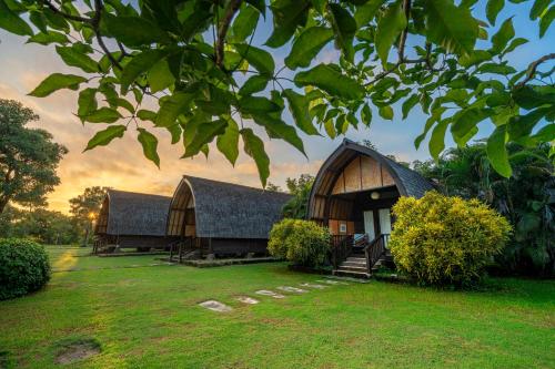 a building with two domes in a yard at Samawa Seaside Resort in Sumbawa Besar