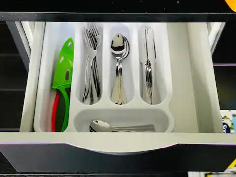 a drawer filled with silver utensils at New Lynn Dream guest house in Auckland