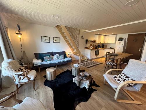 a living room filled with furniture and a staircase at Appartement Vars, 4 pièces, 6 personnes - FR-1-773-25 in Vars