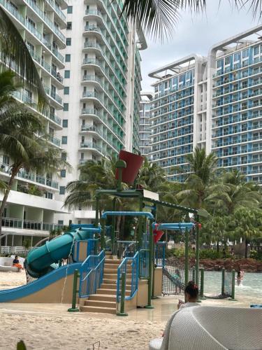 a playground at a resort with a slide at Azure Staycation Place in Manila