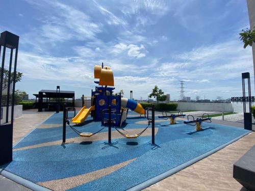 a playground with a slide in a park at Dreamstay36 3R2B 8pax Meritus perai in Perai
