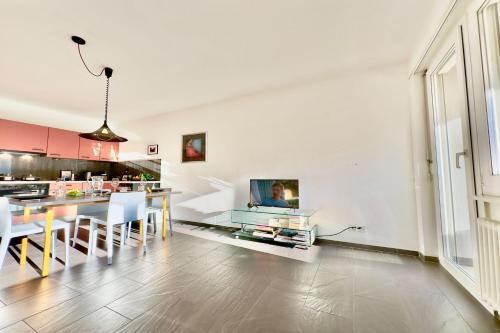 a living room with a kitchen and a dining room at Malibu46 - Happy Rentals in Minusio