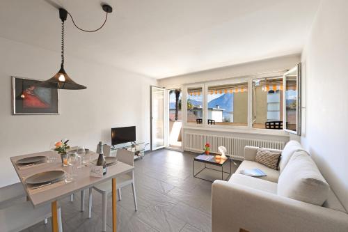 a living room with a couch and a table at Malibu46 - Happy Rentals in Minusio