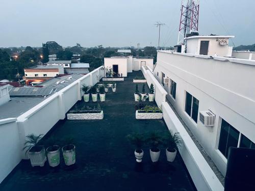 a view of a balcony of a building with plants at Los Guacamayos La Ceiba in La Ceiba