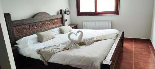 a bedroom with two beds with white sheets at VILLA DOLARETXE by Urdaibai Rentals in Bilbao