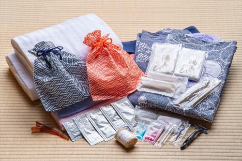 a pile of fabric and other items on a table at Hanare Yado Yosizumi in Ito