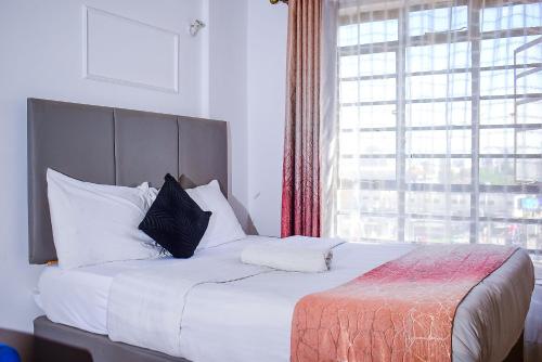 Krevet ili kreveti u jedinici u objektu Luxxe Lofts-West Suites