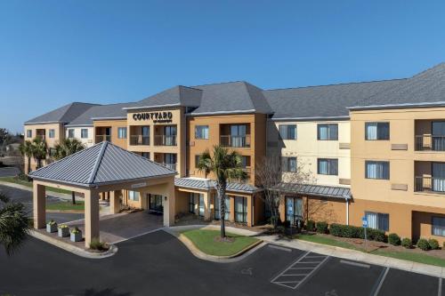 an aerial view of a hotel with a parking lot at Courtyard by Marriott Panama City in Panama City