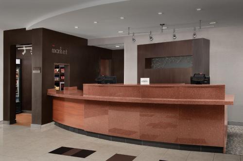 a lobby with a reception counter in a store at Courtyard by Marriott Panama City in Panama City