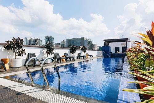 a swimming pool on the roof of a building at Santa Grand Hotel East Coast a NuVe Group Collection in Singapore