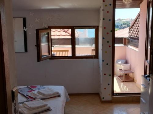 Ένα ή περισσότερα κρεβάτια σε δωμάτιο στο Guesthouse Olimp