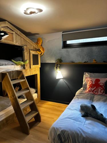 a bedroom with a bunk bed and a bunk ladder at Waterlinie Lodges in Utrecht