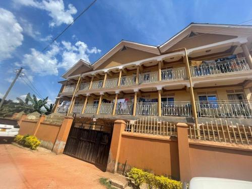a large house with balconies on a street at Kabale town flat in Kabale