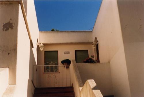 a stairway leading up to a house with a balcony at Residenza Santa Maria in Capri