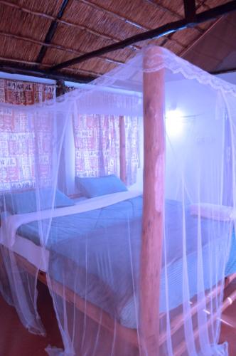 a bed covered in plastic in a room at Kabalega Diner Limited in Nalakonge
