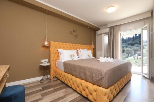 a bedroom with a large bed and a window at Ulivi Verdi Villa in Kontokali