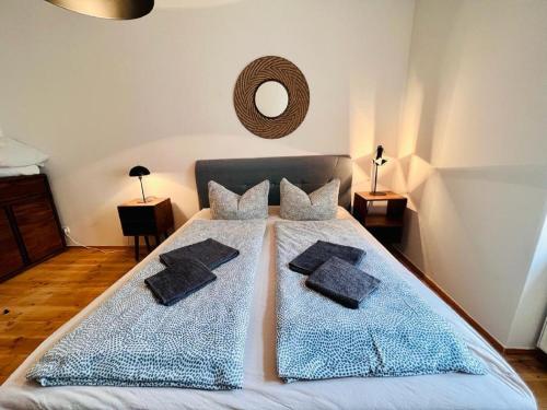 a bedroom with a bed with two pillows on it at Central City Cosy Lux in Berlin