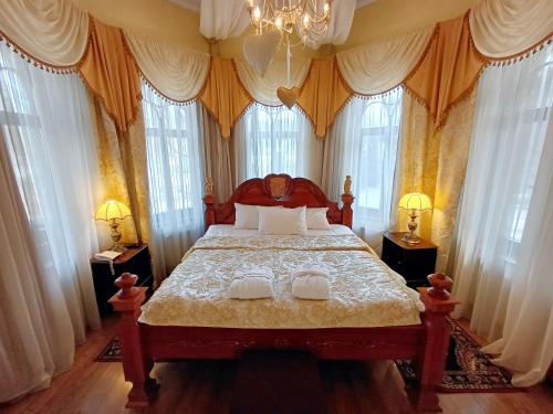 Postel nebo postele na pokoji v ubytování Pegasa Pils Spa Hotel