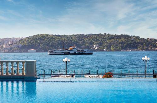 a large boat in a large body of water at Çırağan Palace Kempinski Istanbul in Istanbul