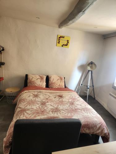 a bedroom with a large bed in a room at Parfum Rose in Grasse
