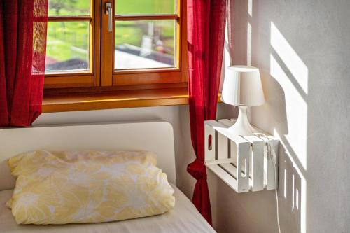 a bedroom with a bed and a window at Haus48 in Neuried