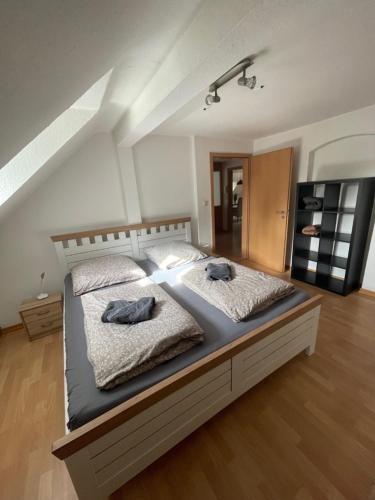 a bedroom with a bed with two pillows on it at kuscheliges Marburg in Marburg an der Lahn